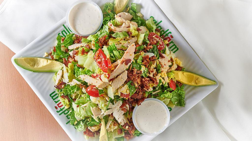 5. Cobb Salad · Crisp romaine hearts, grape tomatoes, crumbled blue cheese, hard boiled eggs, apple wood bacon, chicken breast, hass avocado, served with blue cheese dressing.