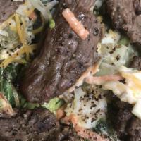 Steak Salad · Mixed greens, tomatoes, mushrooms, steak, avocado, corn, beets.