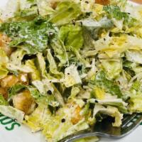 2. Caesar Salad · Crisp romaine hearts, baked seasoned croutons and shaved parmesan cheese served with our tra...