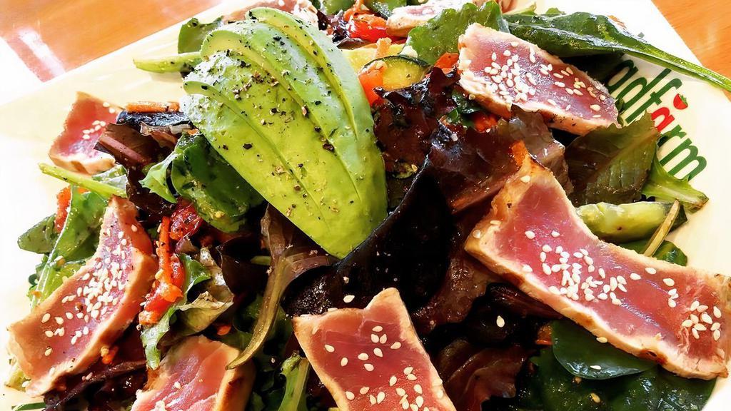 10. Seared Tuna Salad · Organic baby field greens, julienne cut carrots, grape tomatoes, persian cucumbers, scallions, topped with seared tuna, and hass avocado served with our ponzu dressing.