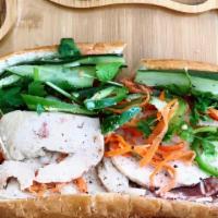 Banh Mi · Made with french roll, mayonnaise, picked carrots & daikon, jalapeno, cucumber, cilantro.
