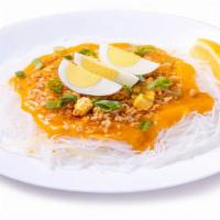 Pancit Palabok · Rice noodles in a seafood sauce with ground pork and tofu; topped with green onion, sliced e...