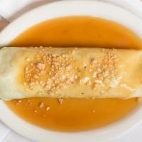 Fresh Lumpia · Crepe filled with sauteéd julienne green beans, carrots, tofu, bamboo shoots, topped with sw...
