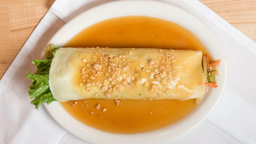 Fresh Lumpia · Crepe filled with sauteéd julienne green beans, carrots, tofu, bamboo shoots, topped with sweet  savory  sauce and ground peanuts.
