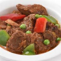 Beef Kaldereta · Classic Filipino beef stew cooked in tomato sauce, liver spread, bell peppers, and spices.