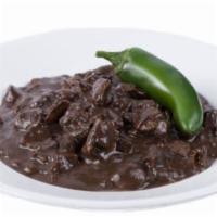 Dinuguan · Savory pork stew simmered in rich dark gravy.