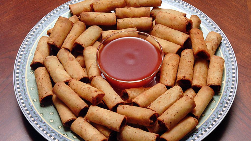 Lumpiang Shanghai, Pork & Shrimp - 2.5 lbs. (Frozen) · Bite-size spring rolls with ground pork & shrimp filling. Serve with our sweet-sour dipping sauce.