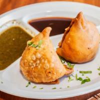 Punjabi Samosa (2 Pcs) · potatoes , peas spices in pastry shell lightly fried.