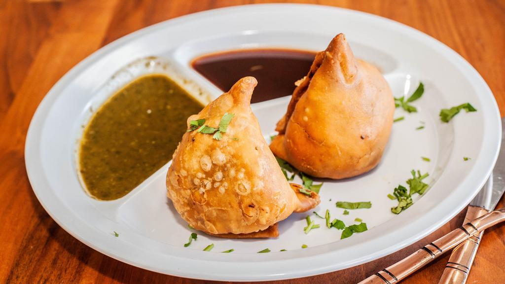 Punjabi Samosa (2 Pcs) · potatoes , peas spices in pastry shell lightly fried.