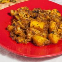 Aloo Gobi · Potatoes, cauliflower, onion, tomato cooked with fresh herbs & spices.