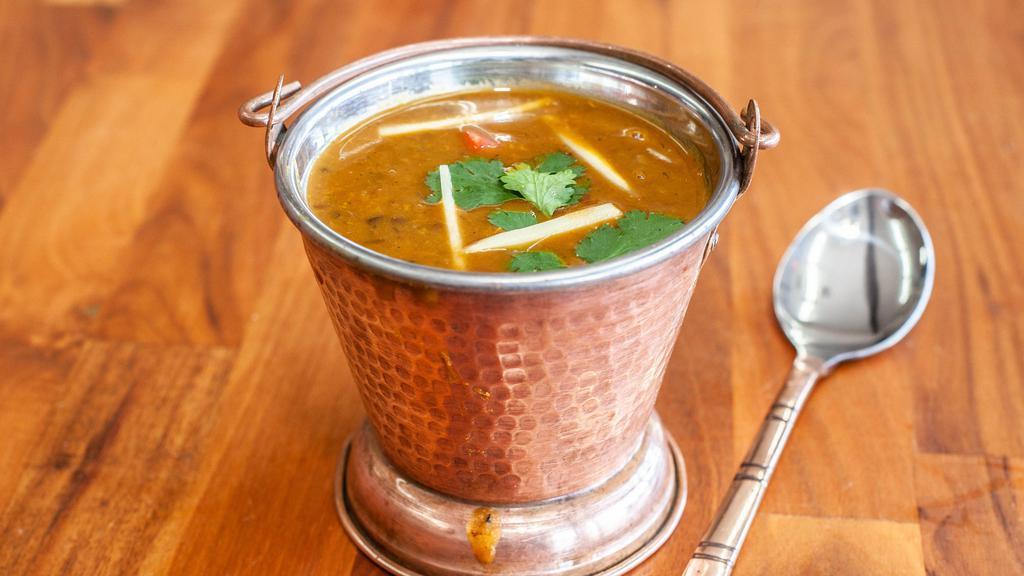 Dal Makhni · Punjabi whole black lentil (urad) traditionally cooked with spices & herb with touch of ghee.