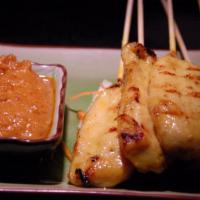 4 Chicken Satay · Marinated chicken on skewers, served with peanut sauce and cucumber salad.
