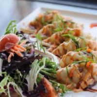 6 Thai Spicy Potstickers · Crispy potstickers with Thai spicy sauce and salad.
