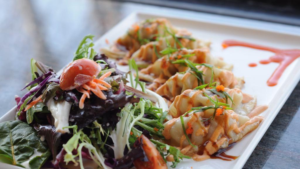 6 Thai Spicy Potstickers · Crispy potstickers with Thai spicy sauce and salad.