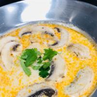 15 Tom Kha · Spicy coconut milk soup with chicken OR prawns lemongrass, galangal, mushroom, lemon juice, ...
