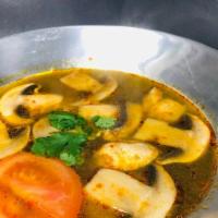 14 Tom Yum · Spicy and sour soup with chicken OR prawns lemongrass, tomato, and mushrooms.