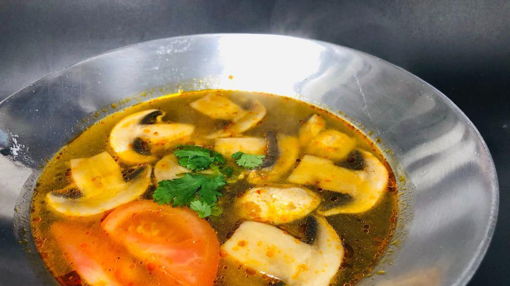 14 Tom Yum · Spicy and sour soup with chicken OR prawns lemongrass, tomato, and mushrooms.