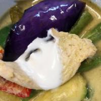 44 Green Curry · Spicy green curry with chicken OR beef OR tofu OR prawns eggplant, basil, red bell, and coco...