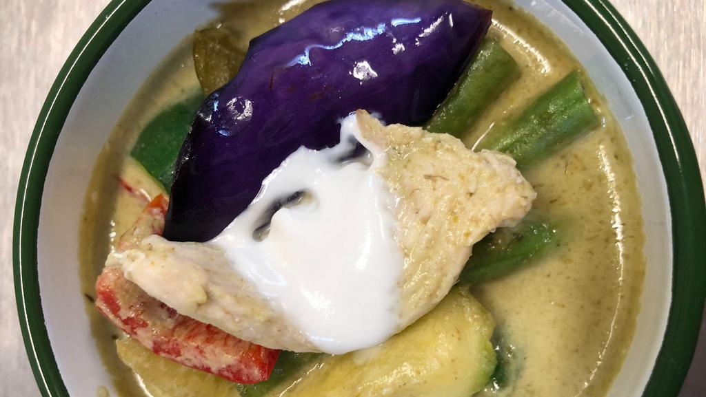 44 Green Curry · Spicy green curry with chicken OR beef OR tofu OR prawns eggplant, basil, red bell, and coconut milk.