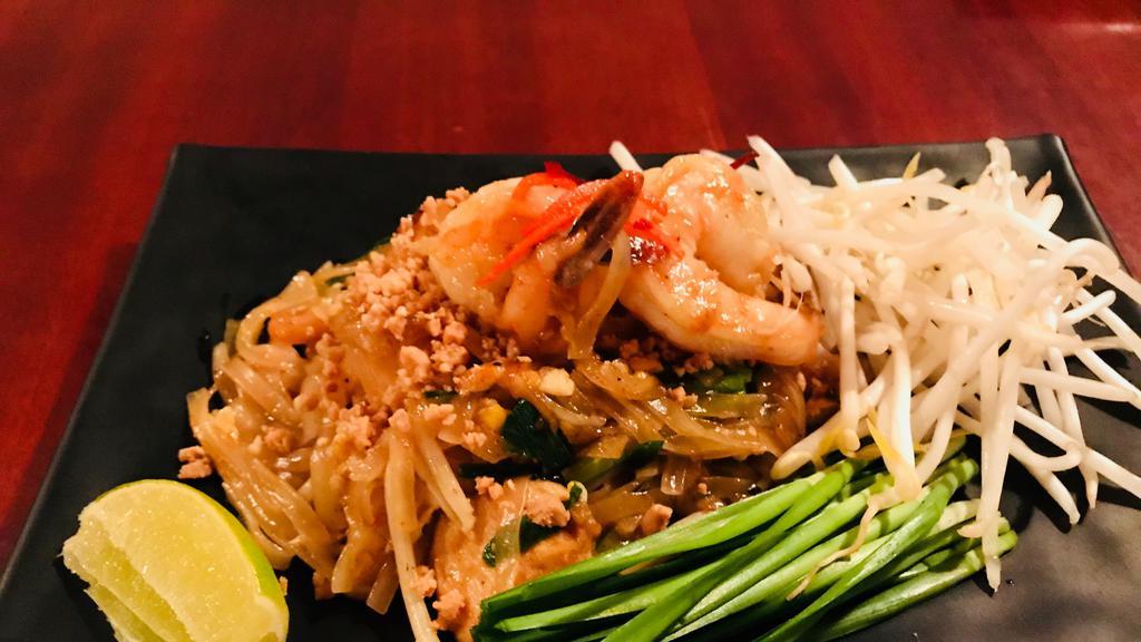 46 Pad Thai · (available with vegetables) The famous fried rice noodles with chicken OR prawns, bean curd, egg, bean sprouts, and ground peanuts.