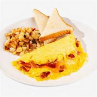 Bacon Cheese Omelette · Three eggs scrambled with cheese and crispy bacon bits. Served with home fries and toast.