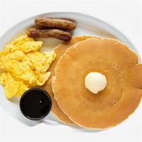 Pancake Combo · Two fluffy pancakes served with syrup and powdered sugar, plus your choice of breakfast meat...