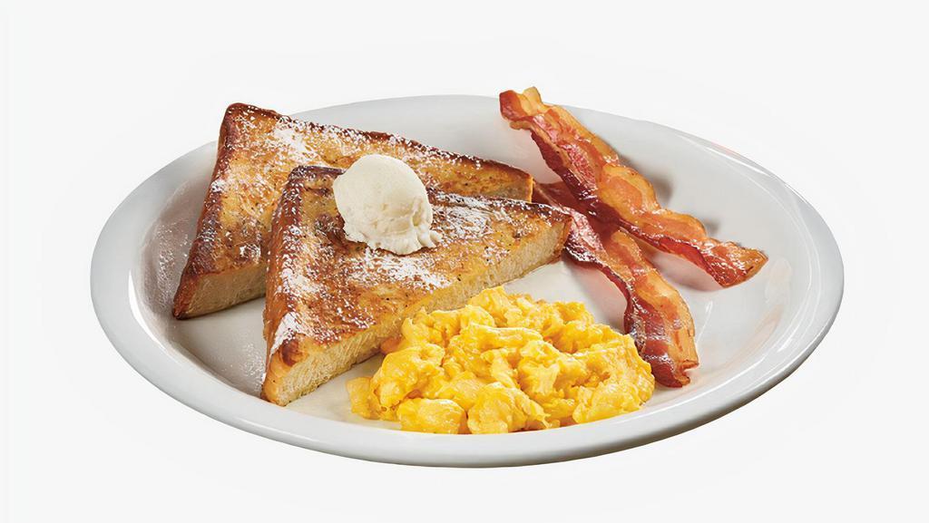 French Toast Combo · Two slices of thick, egg-washed cinnamon bread served with syrup and powdered sugar, plus your choice of breakfast meat and two eggs your way.