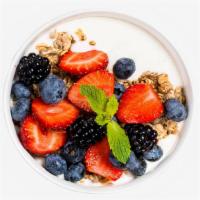 Granola Bowl · Creamy yogurt topped with crunchy granola and fresh strawberries, blueberries, and bananas.