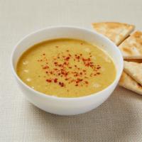 Red Lentil Soup (V) · Blended red lentil, potato, carrot and onion with cumin and red pepper. Served with pita bre...