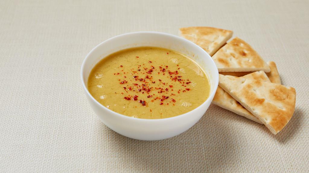 Red Lentil Soup (V) · Blended red lentil, potato, carrot and onion with cumin and red pepper. Served with pita bread. Gluten-free (no pita). Vegan.