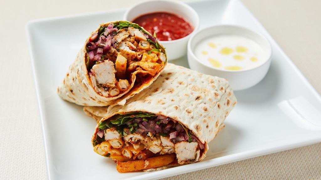 Mediterranean Chicken Wrap · Roasted organic spicy chicken thighs, lettuce, tomato, cucumber, pickled red onion and spicy yogurt dressing wrapped in warm lavash with pepper paste. Served with spicy yogurt sauce.