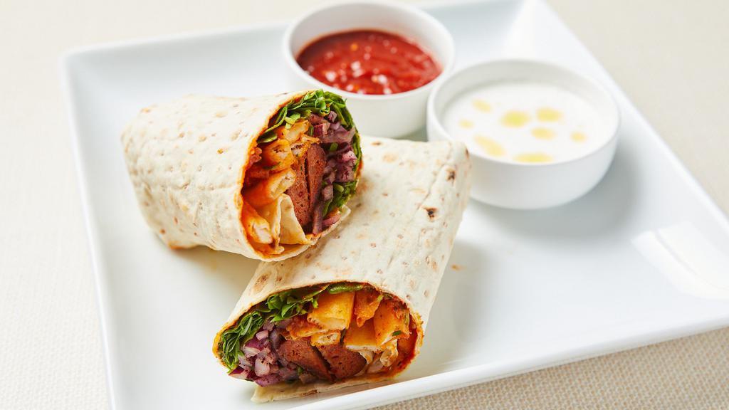 Mediterranean Meatball Wrap · Roasted spicy lamb kebab, lettuce, tomato, cucumber, pickled red onion and spicy yogurt dressing wrapped in warm lavash with pepper paste. Served with spicy yogurt sauce.