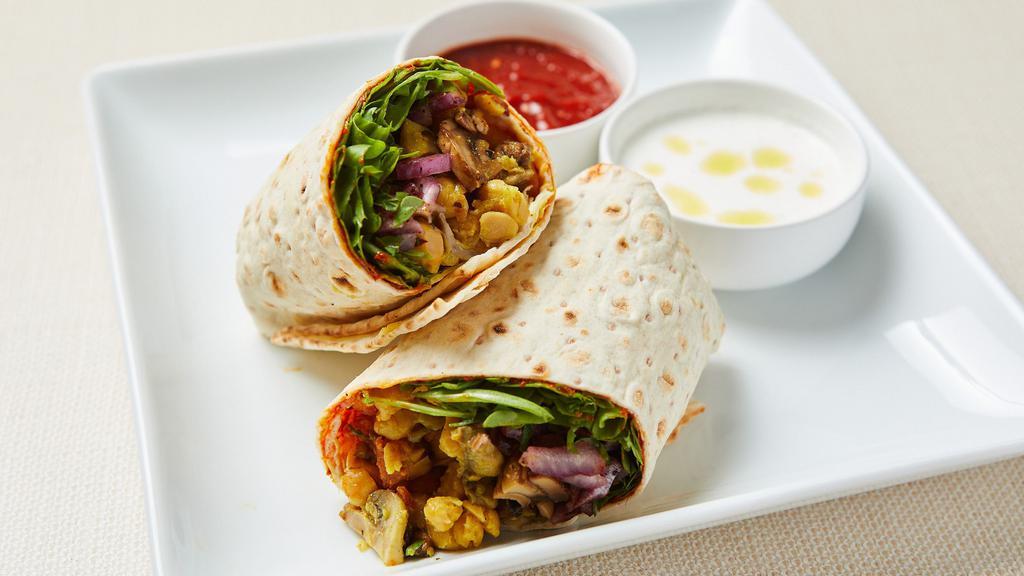 Mediterranean Chickpeas Wrap (V) · Roasted curry chickpeas with mushroom, lettuce, tomato, cucumber and pickled red onion wrapped in warm lavash with pepper paste. Served with hot sauce. Vegan.