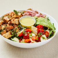 Mediterranean Chicken Salad · Mixed green salad (arugula, spinach, lettuce) served with roasted organic spicy chicken thig...