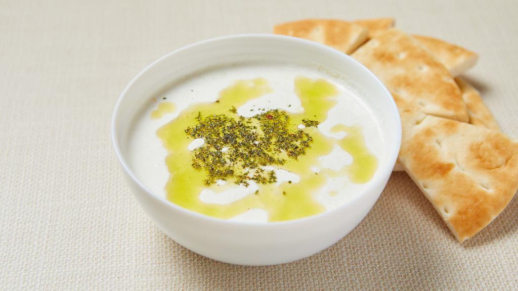 Tzatziki (Cucumber Yogurt Dip) · Homemade cucumber yogurt dip with olive oil and dry mint. Served with pita bread. Gluten-free (no pita).