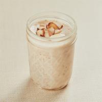 Keskul (Almond Pudding) · Homemade gluten-free pudding in a mason jar made with rice flour, milk, sugar, almond and co...
