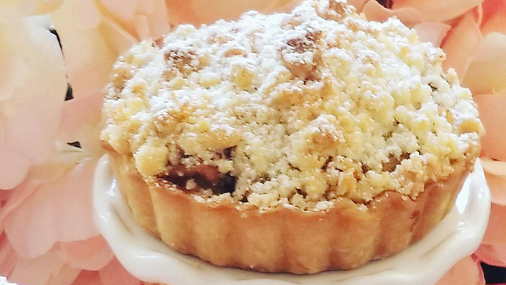 Apple Almond Pie · Sweet apples, almond cream, cinnamon and our signature almond crumble topping. Freezer friendly. Contains: wheat, butter, almond, egg.