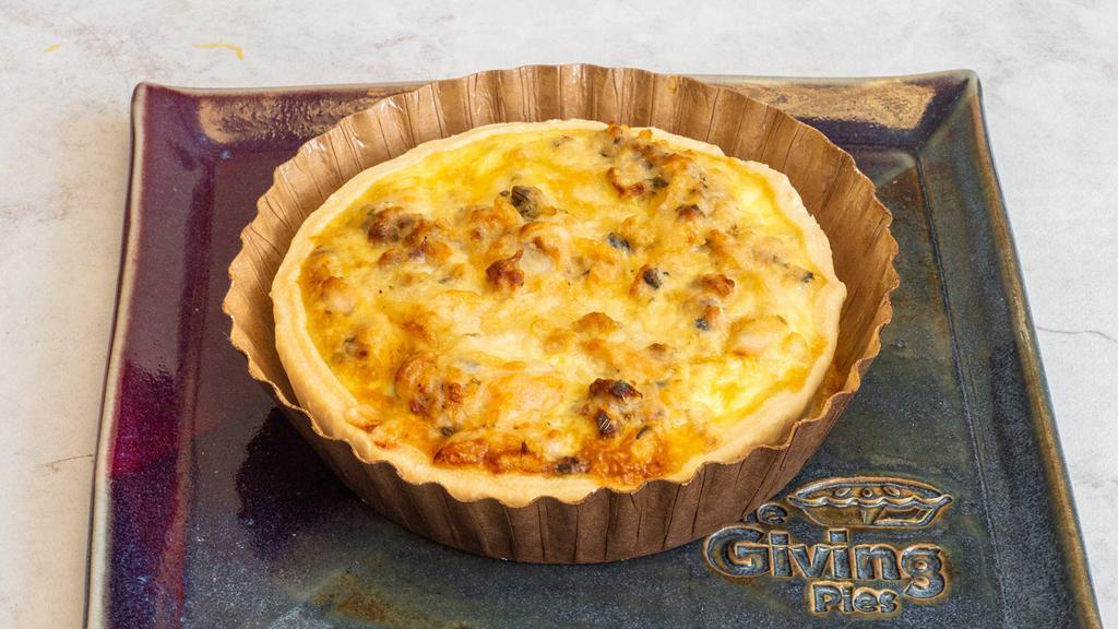 Salmon And Zucchinis · The salmon brings an unexpected flavor, making this quiche a customer favorite!