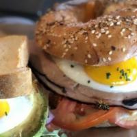 Breakfast Bagel · smoked ham, eggs, cheddar cheese, cream cheese spread & tomatoes on a freshly baked bagel