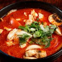 Tom Yum · Spicy. Hot and sour soup with lemongrass, kaffir lime leaf, mushroom, onion, and tomato.