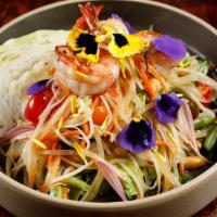 Tum Jung with Prawns · Spicy. Shredded green papaya and carrot, tomato and crushed peanut served with tamarind lime...