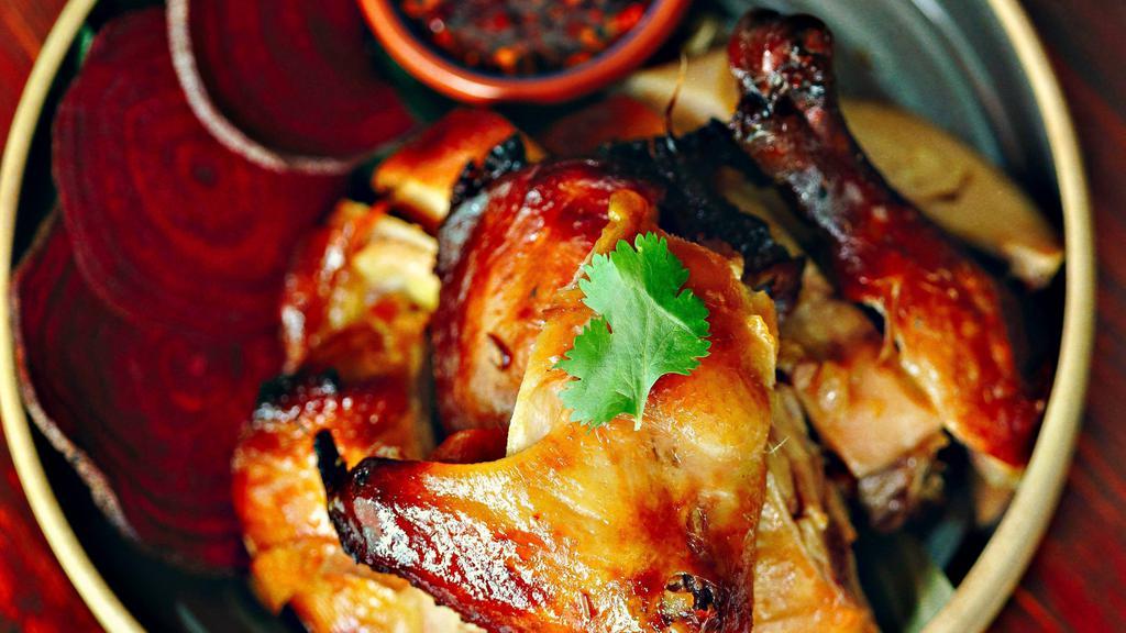 Barbeque Chicken · Half-grilled chicken marinated with coconut milk and Thai spices. Served with sticky rice and spicy sweet and sour sauce.