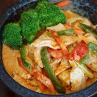 Panang Curry · Spicy. Thai spicy peanut curry with coconut milk, bell pepper and kaffir lime leaves with yo...