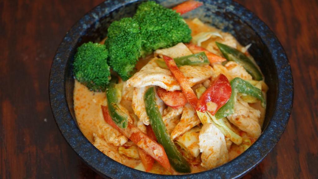 Panang Curry · Spicy. Thai spicy peanut curry with coconut milk, bell pepper and kaffir lime leaves with your choice of protein.