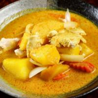 Yellow Curry · Spicy. Yellow curry paste with coconut milk, potato, carrot, and onion with your choice of p...