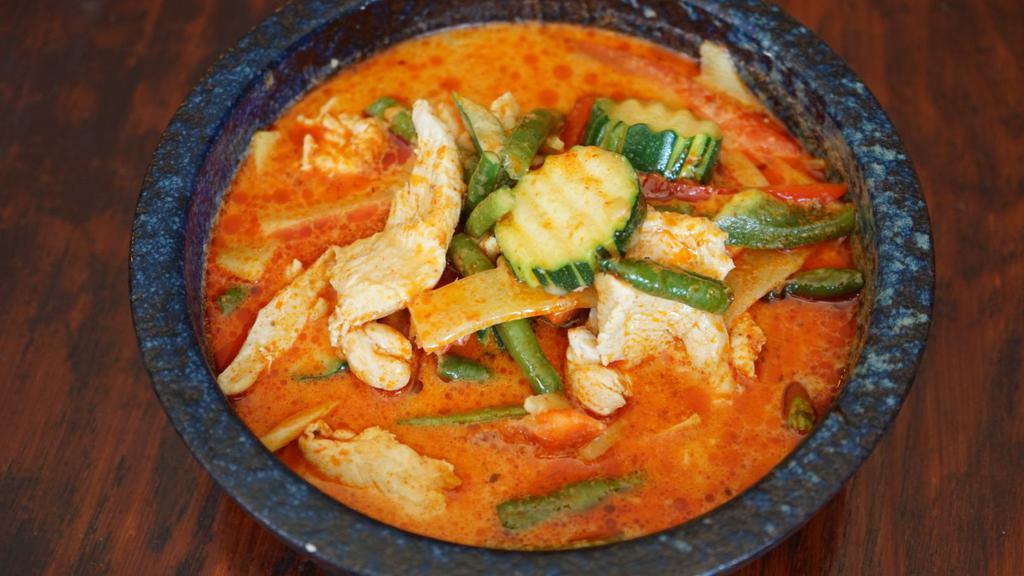 Red Curry · Spicy. Curry paste coconut milk, bamboo shoot, bell pepper, green bean and basil with your choice of protein.