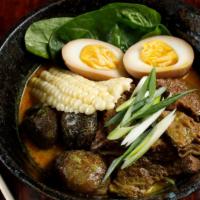 Nuea Ramen · Ramen noodles in five spices broth slow cooked beef, spinach, caramel egg, and shiitake mush...