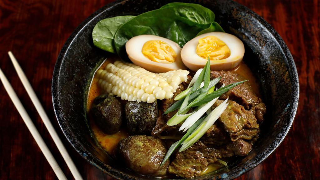Nuea Ramen · Ramen noodles in five spices broth slow cooked beef, spinach, caramel egg, and shiitake mushrooms with your choice of broth.