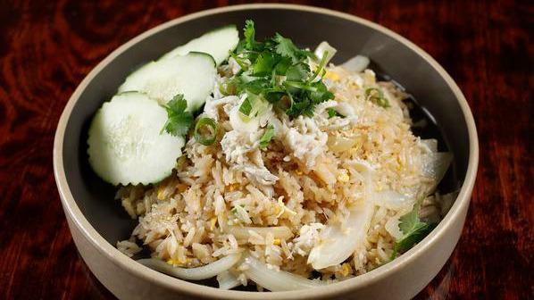 Crab Fried Rice · Fried rice with double eggs, onion and green onion top with crab meat. Served with fresh cucumber.