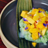 Mango Sticky Rice · Sweet sticky rice served with mango and topped with coconut cream.